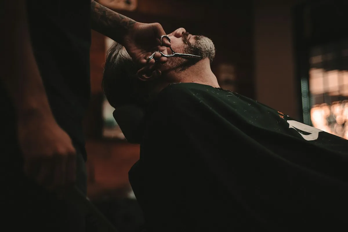 A barber giving a client a straight-razor shave